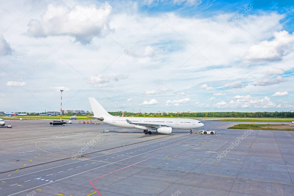 Push back the plane airplane by a tow truck before starting the engines and taking off from the airport