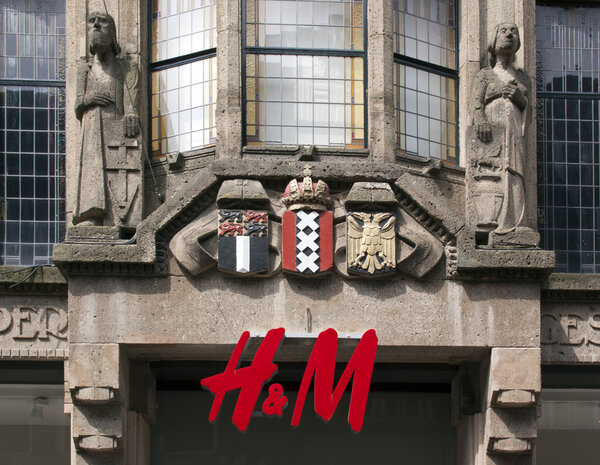 Amsterdam,netherlands-may 27, 2015: H&M sign on a classic facade of a building in Amsterdam, netherlands