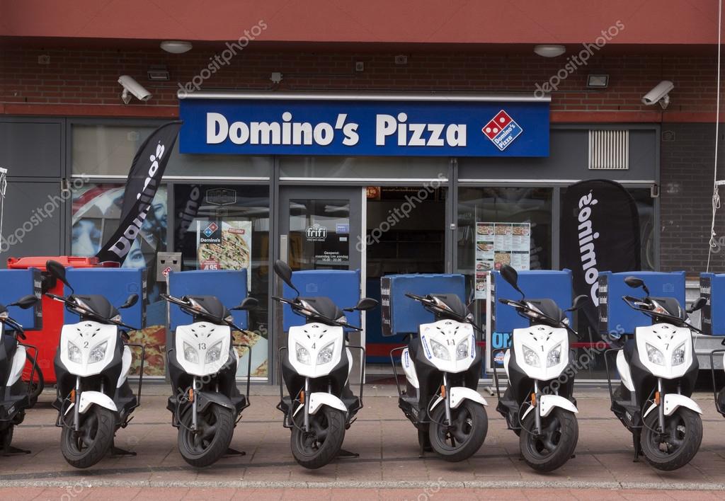 The Hague,netherlands-june 9, 2015:  Domino's pizza store in the hague with scooters in the front