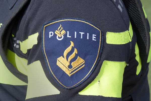 Batch on the uniform of a dutch police officer — Stock Photo, Image