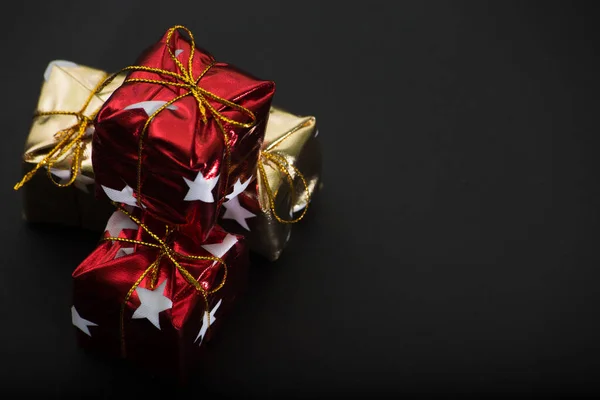 Small Golden Red Gift Boxes Next Photo Space Text Black — Stock Photo, Image