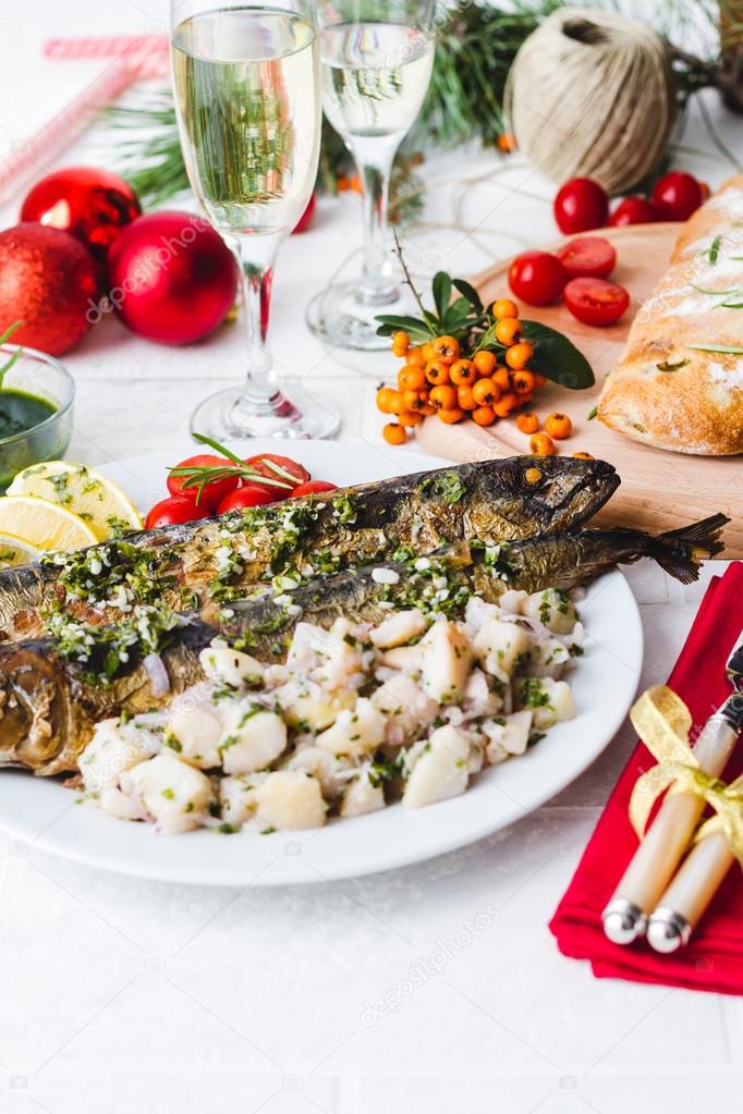 Roasted whole mackerel fish stuffed with vegetables and almonds 