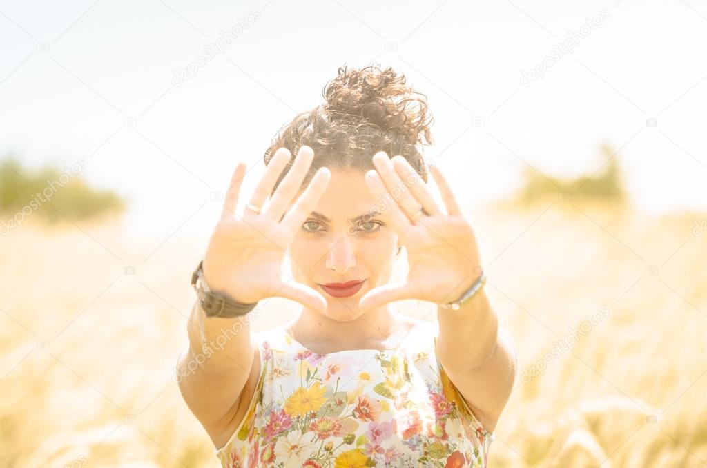 Beautiful Woman with Floral Dress in Wheat Field. Vintage Instag