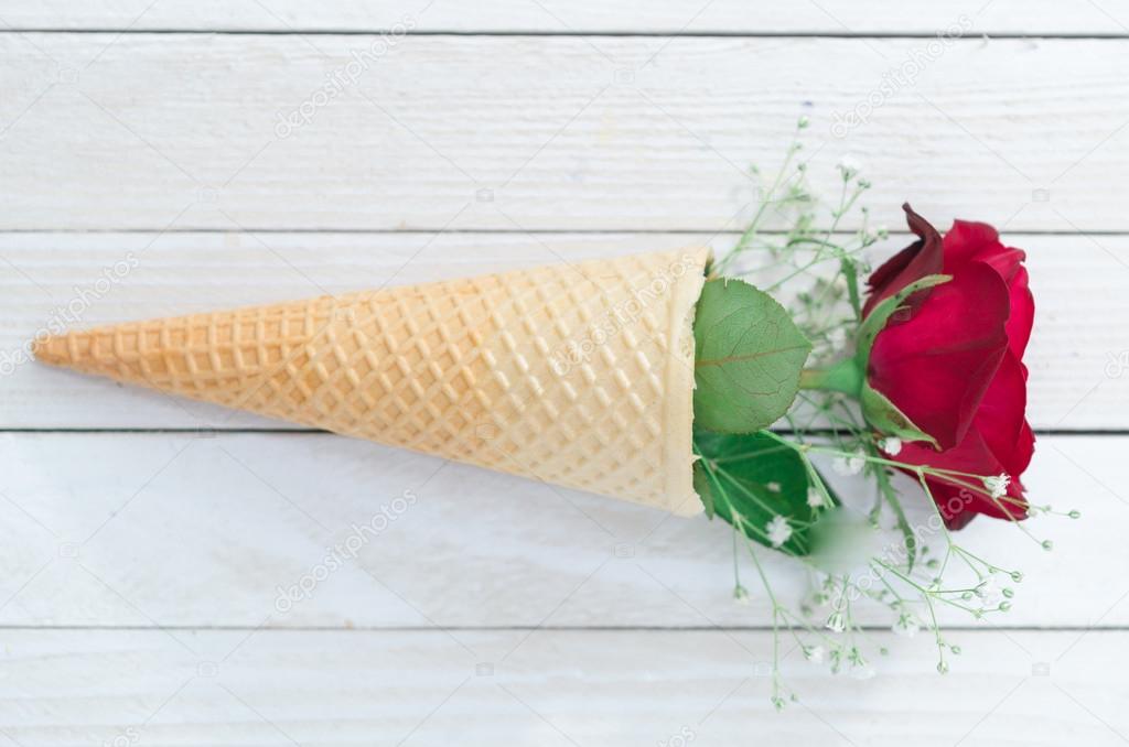 Ice cream cone with red rose