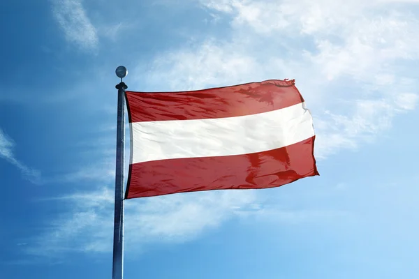 Flag of Latvia on flagpole — Stock Photo, Image