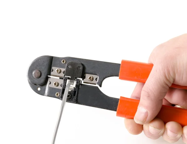 Man hand crimps internet cable — Stock Photo, Image