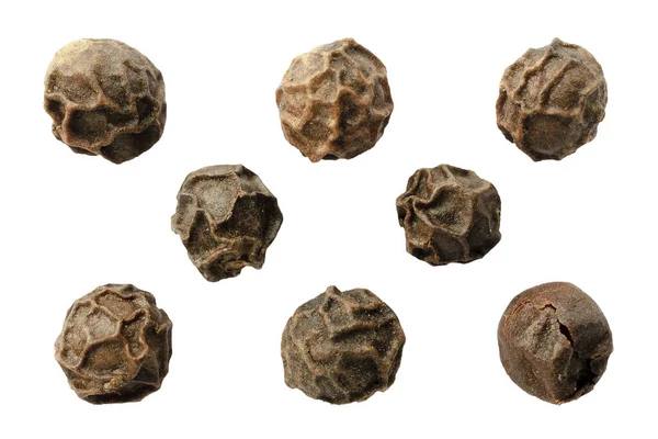 Beyaz arka planda karabiber izole edilmiş, üst manzara. Baharat, makro. Beyaz arka planda siyah biberli makro. Beyaz arka planda siyah biber, üst manzara, yakın plan. Beyaz arka planda kuru biber.