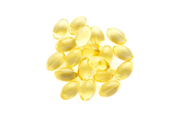 Balık yağı kapsülleri beyaz arka planda izole edilmiş, üst manzara. Beyaz arka planda izole edilmiş sarı balık yağı kapsülleri. Omega-3 balık yağı kapsülleri. Sarı balık yağı kapsüllerine yakın çekim.