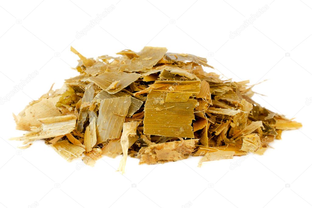 Fermented corn silage. Energy feed for livestock - maize silage. Corn silage chopped for feeding livestock. Food for cattle in winter. Pile of maize silage. Isolated. Close-up.