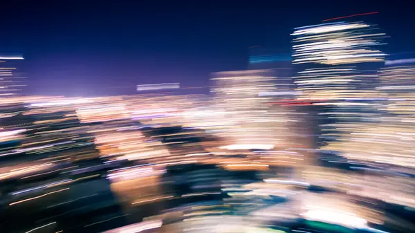 Desfoque de movimento de luzes da cidade — Fotografia de Stock