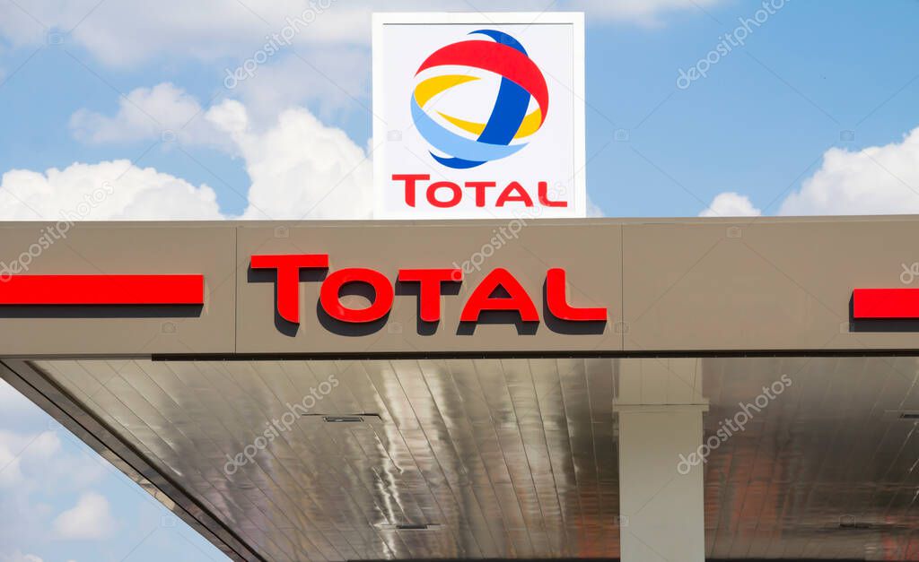 Total sign identifying a gas station. Total is a French multinational oil company and one of the Supermajor oil companies in the world.