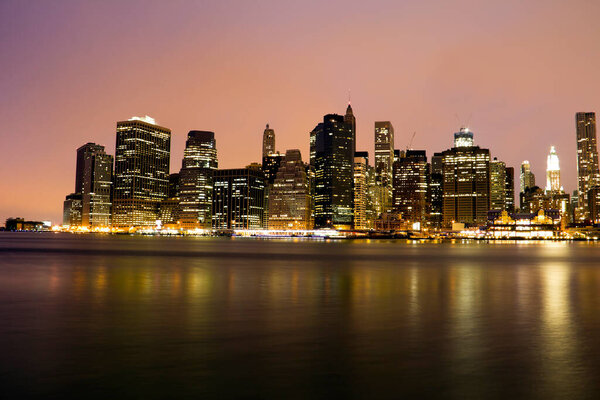 New York City Brooklyn Bridge and Manhattan skyline with skyscrapers over Hudson River