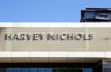 Shop frontage of a Harvey Nichols store. Harvey Nichols, founded in 1831, is a British department store chain with a flagship store in Knightsbridge, London. clipart