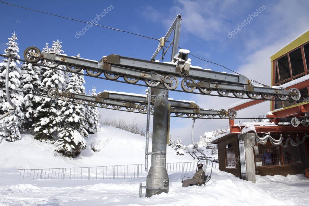 ski lift, skiers on the snow mountain