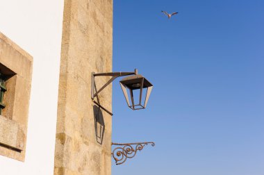 Old wall with lantern in Porto