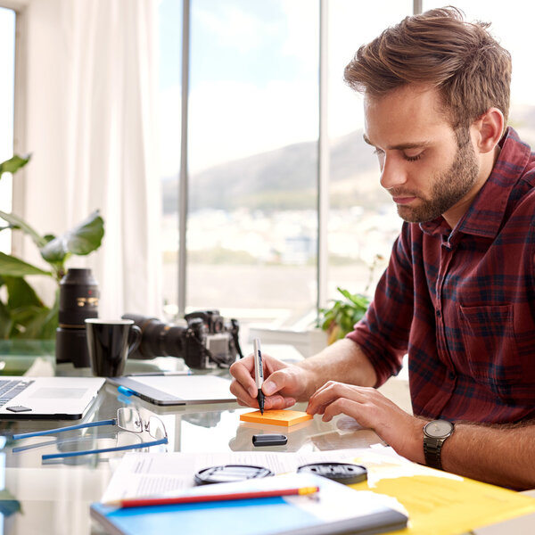 businessman busy taking notes