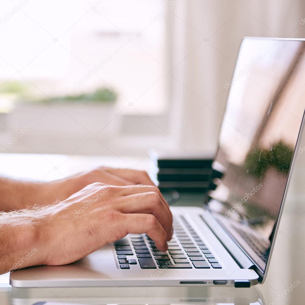 hands working on modern laptop