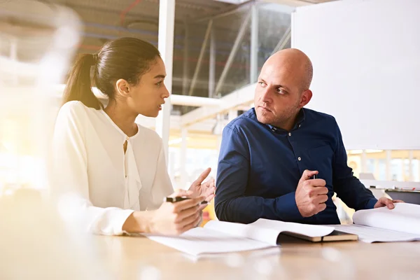 Businessman and businesswoman at a modern office — Stock Photo, Image