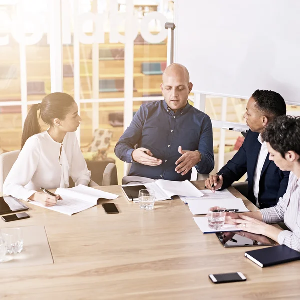 Team of creatives paying attention to marketing manager — Stock Photo, Image