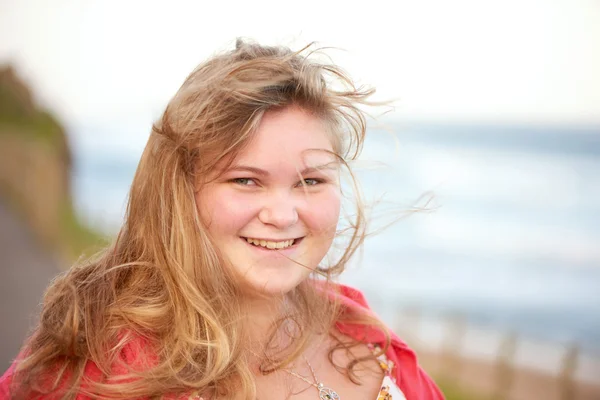 Young plus size model smiling at the camera — Stock Photo, Image