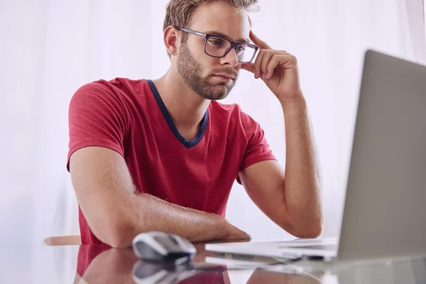 Young professional working from his home office — Stock Photo, Image