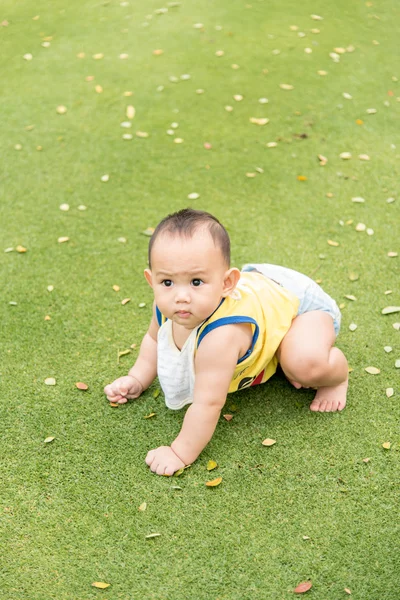 Baby boy in action at the park — Stock Photo, Image