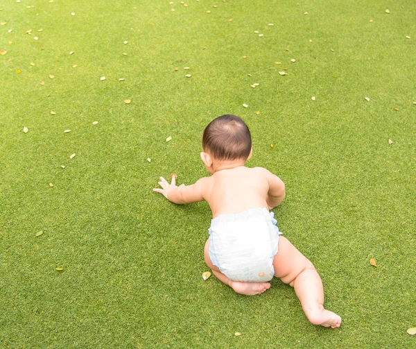 Baby boy in action at the park — Stock Photo, Image