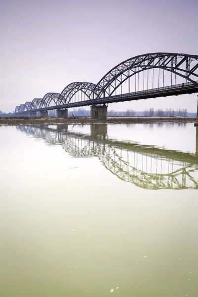 The Gerola iron bridge, over the Po river, Lombardy Province of Pavia. Color image — Stock Photo, Image