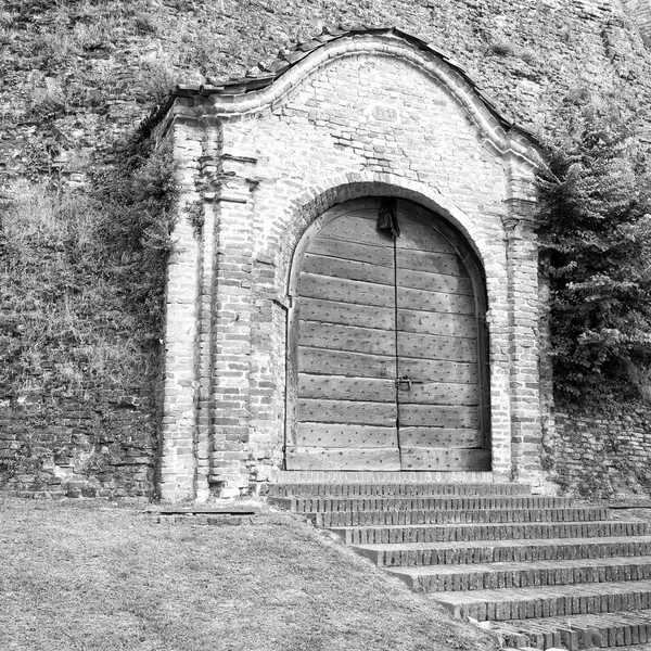 Old medieval castle gate. Black and white photo