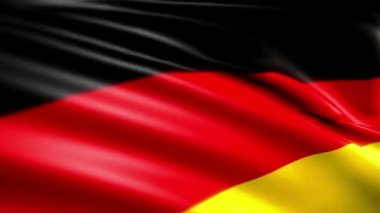 Almanya 'nın rüzgarda dalgalanan bayrağının yakın görüntüsü.
