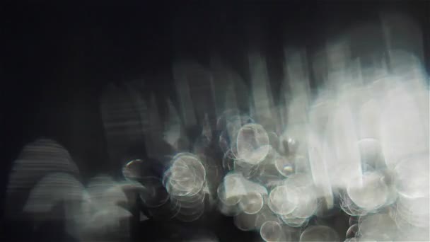 Weiße Lichtblasen auf schwarzem Hintergrund — Stockvideo