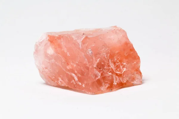 pink quartz with white background. pink stone
