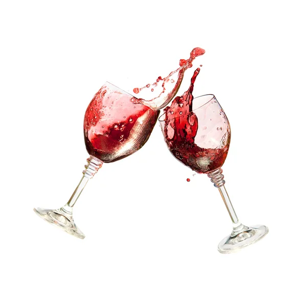 Due bicchieri di vino che si stringono insieme in un toast schizzato — Foto Stock