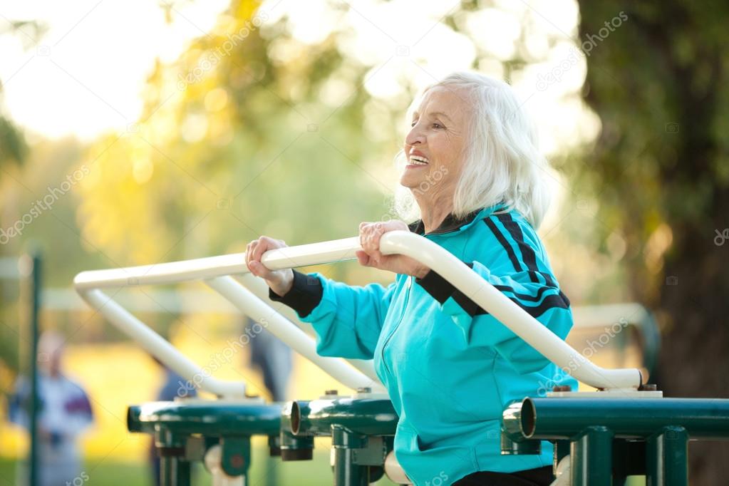 Senior Woman doing Exercises Outdoors