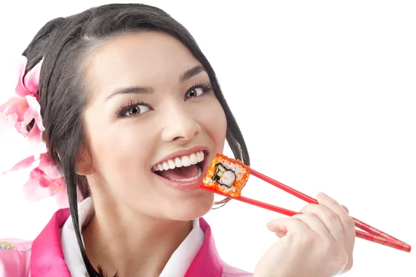 Mutlu kadın suşi yemek çubukları ile yemek — Stok fotoğraf