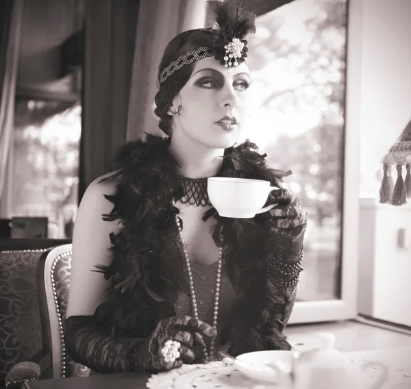 Retro Woman 1920s - 1930s Sitting with Cup of Tea — Stock Photo, Image