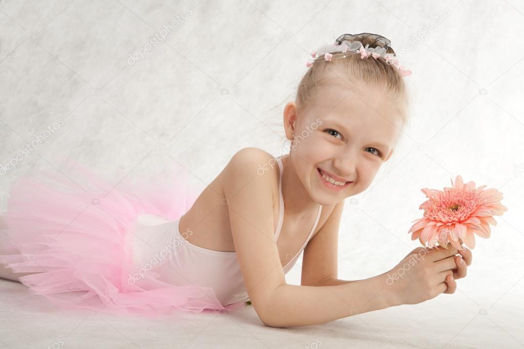Little cute ballet-dancer with flower in the tutu