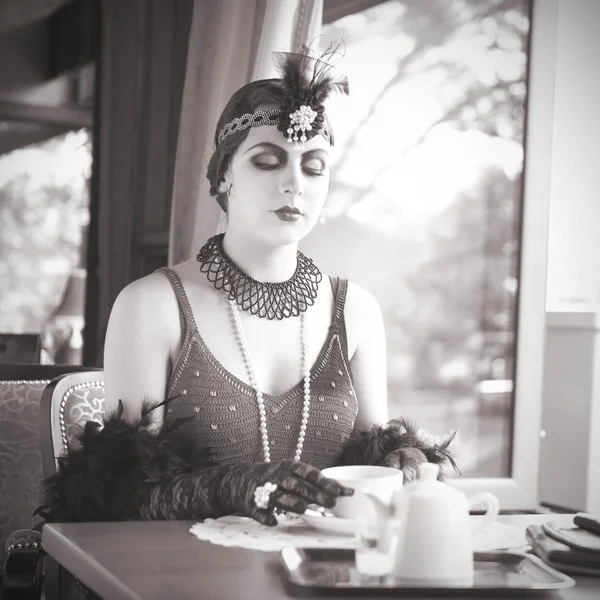 Retro Woman 1920s - 1930s Sitting with Cup of Tea — Stock Photo, Image