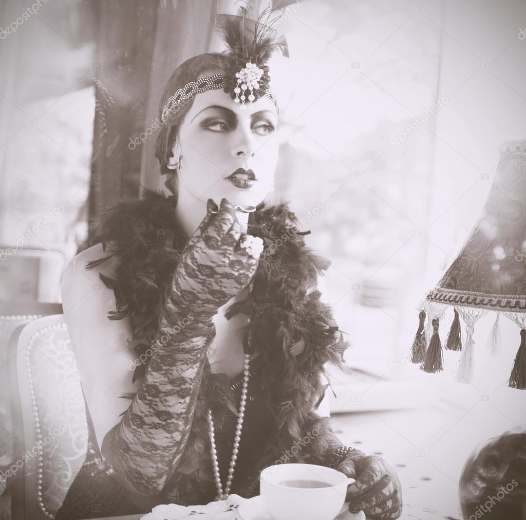 Retro Woman 1920s - 1930s Sitting in the Cafe