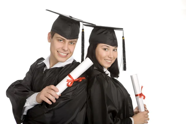 Deux diplômés souriants au fond blanc — Photo