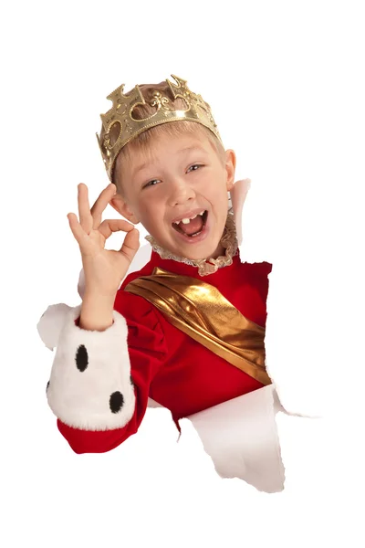 Happy little king looking out from the paper — Stock Photo, Image