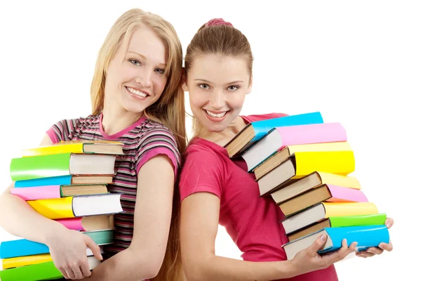 Deux jeunes femmes heureuses tenant des livres — Photo