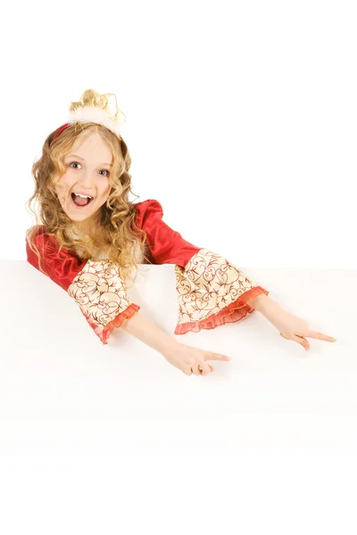Šťastná malá princezna ukazuje znamení — Stock fotografie
