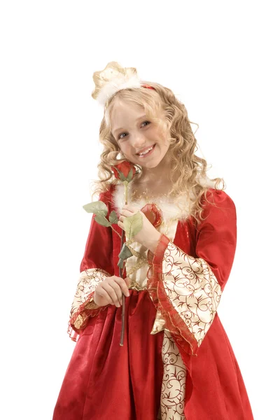 Bella sorridente bambina in costume da principessa in piedi con — Foto Stock