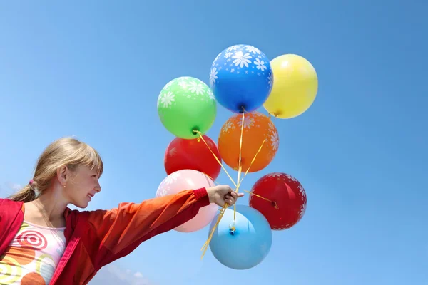 Happy Girl Holding Colorful Helium Balloons in the Sky — Stock Photo, Image