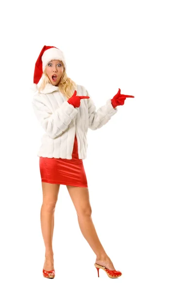 Sexy chica vestida como Santa Claus señala dedo para copiar espacios — Foto de Stock