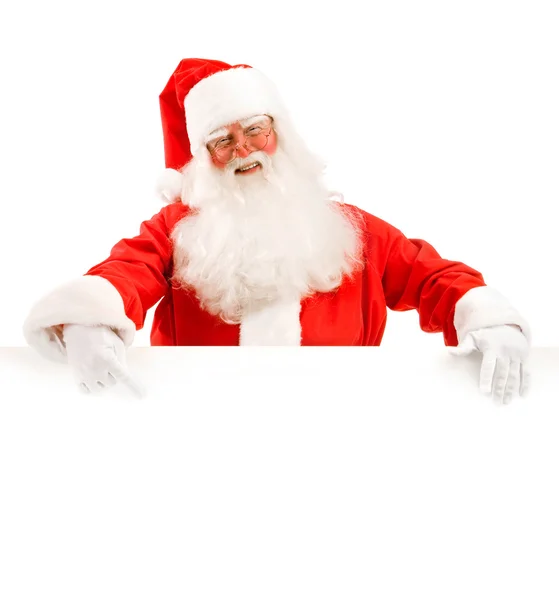 Santa Claus Holding a Advertising Space Stock Photo