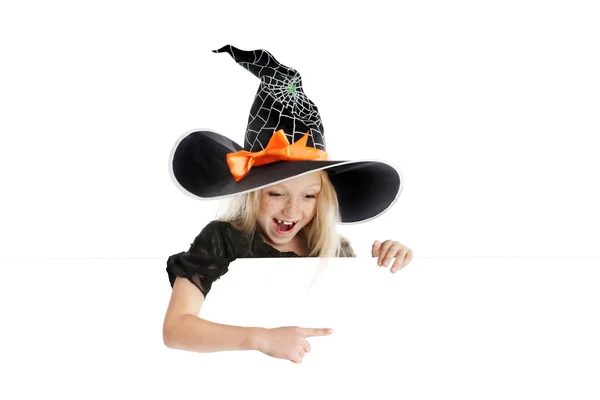 Little playful witch holding a sign — Stock Photo, Image