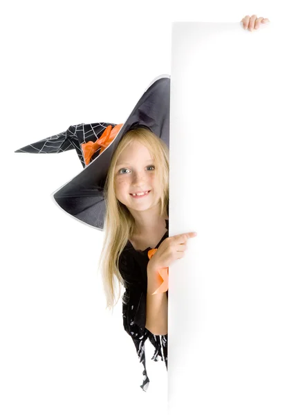 Pequena bruxa brincalhona segurando o espaço Copiar — Fotografia de Stock