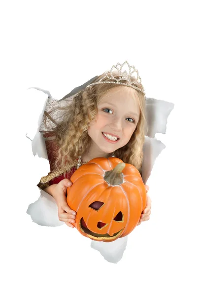 Breakthrough beautiful princess holding a pumpkin. — Zdjęcie stockowe